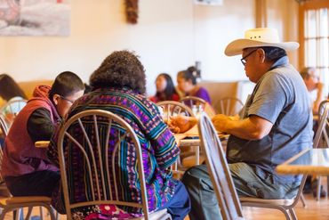 Group of people having food inside the restaurant