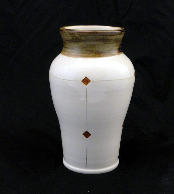 Wheel thrown table vase. White body with line and color details. Interior design for home or office.