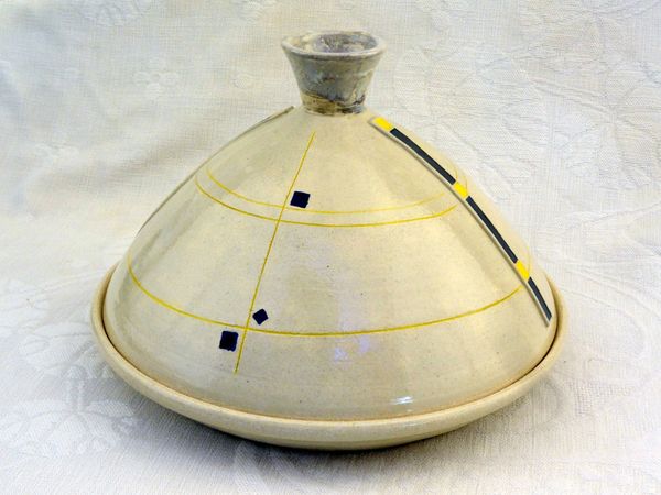 Tagine in stoneware, cooking your favorite food with great design. Line and color beauty.