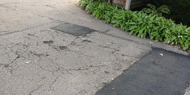 Residential asphalt repairs in Northfield, MN including crack repair and patch work.