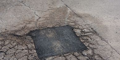 Commercial pothole repair restoring a parking lot surface in Northfield