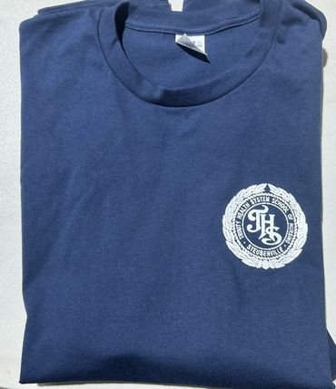 Folded navy blue shirt with a white printed emblem on the chest.