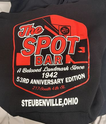 Black hoodie with red and white print celebrating The Spot Bar's 53rd anniversary in Steubenville, Ohio.