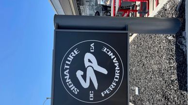 Signage for Signature Performance of CA at a parking lot.