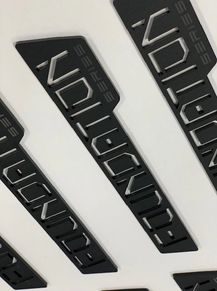 Black plastic nameplates with the word 'SERIES' and stylized text.