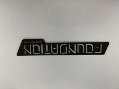 Black emblem with 'FOUNDATION SERIES' text on a white background.