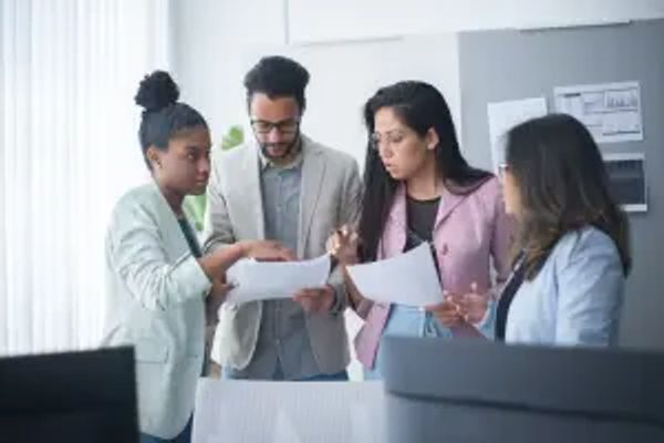 Group of doctors analyzing reports