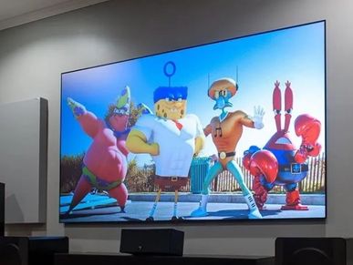 TV showing SpongeBob characters in superhero costumes.