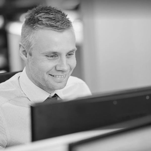 Luke the financial planner in a black and white image 