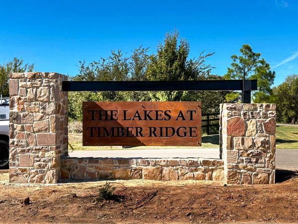 Stone entrance sign for The Lakes at Timber Ridge community.