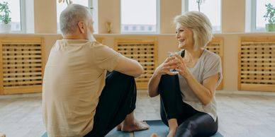 older couple doing yoga