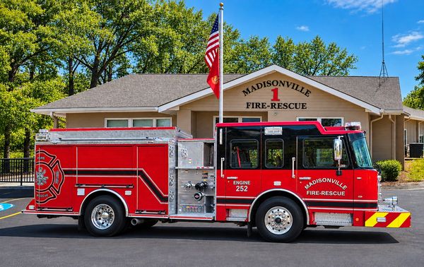 Madisonville fire rescue truck parked in front of the station.