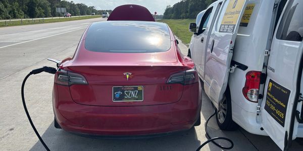 Mobile EV Charging service provided to a Tesla Model S on the US 99 Grand Parkway north of Houston