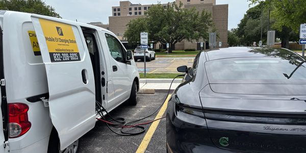 Electric car charging from a mobile EV charging van.