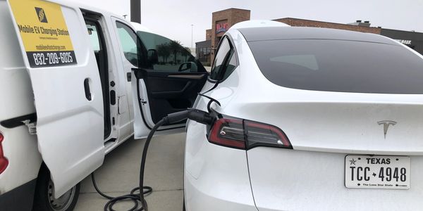 Tesla mobile charging station. Emergency EV Charging service. AAA roadside assistance.  