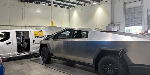 Emergency Tesla mobile charging service on a Tesla Cybertruck for a returning US military service me