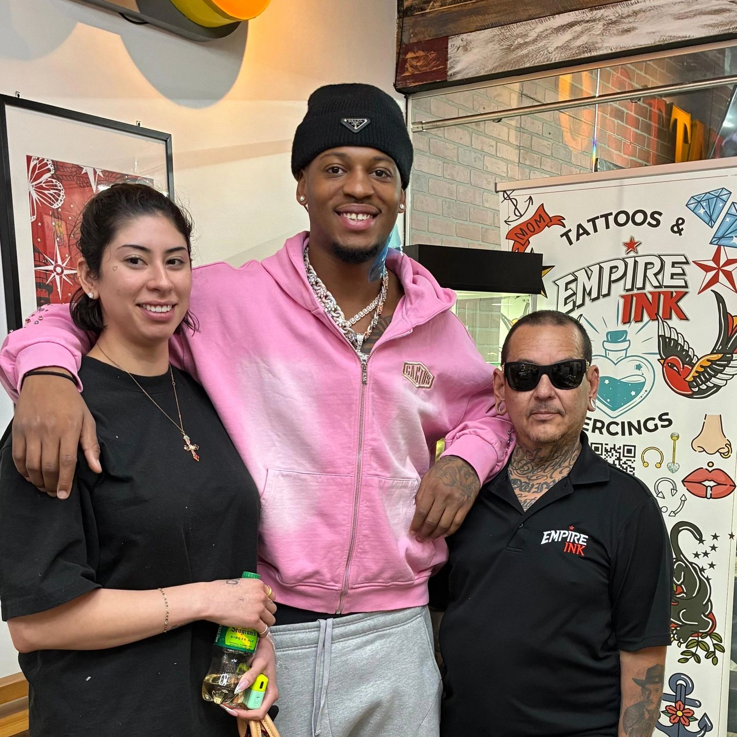 Group of people smiling after getting tattooed at empire ink downtown miami 