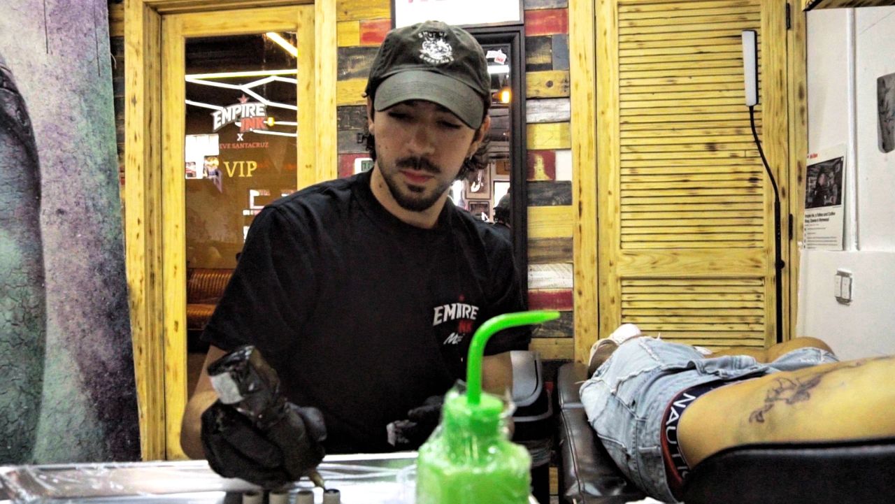 tattoo artist at empire ink miami beach tattooing