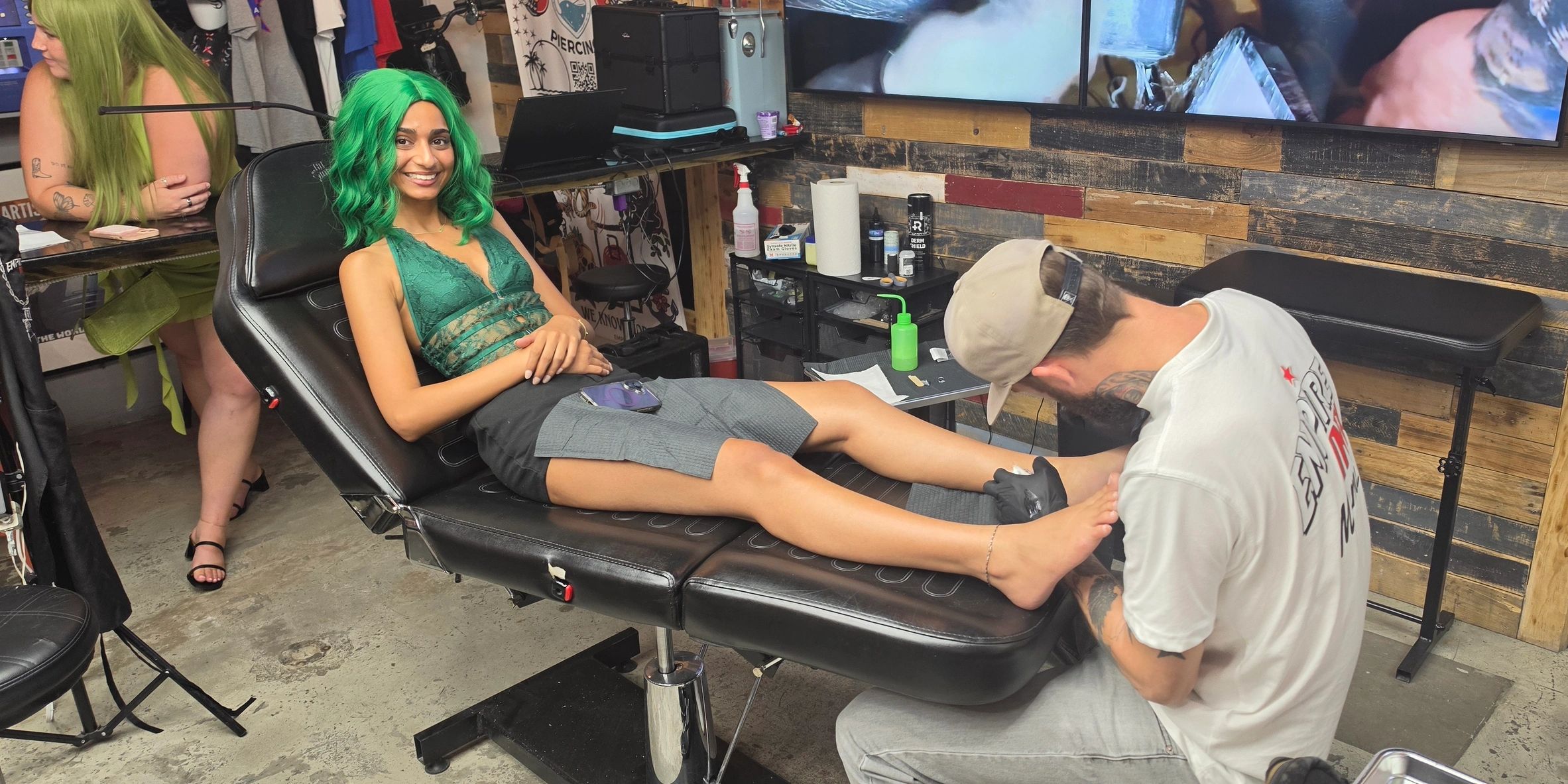 happy girl getting tattooed by empire ink Miamis best ink