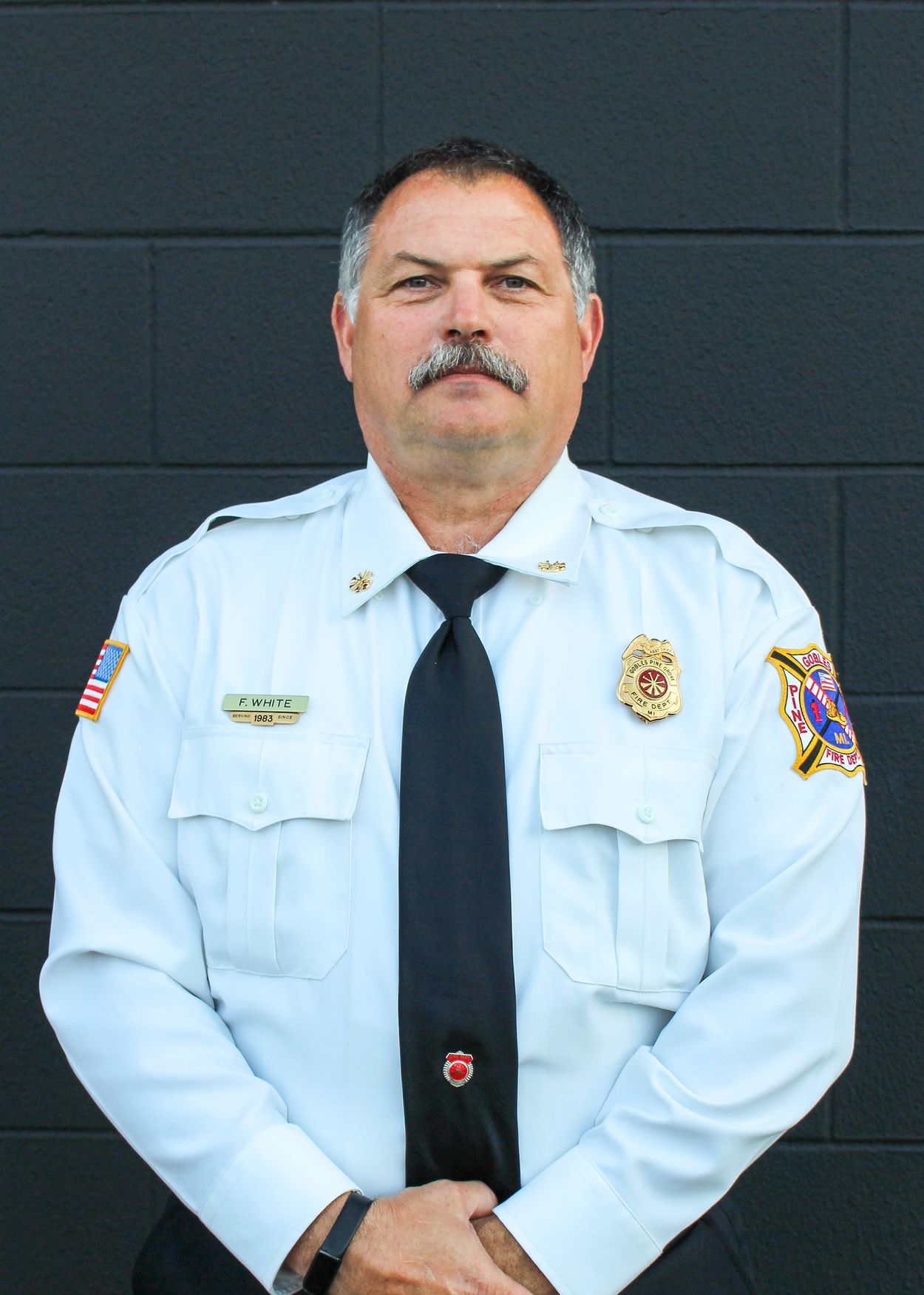 Portrait of a fire chief in uniform.