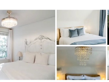 Elegant bedroom with white theme and crystal chandelier.