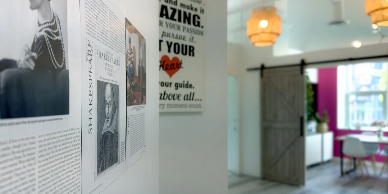 A bright room with Shakespeare posters and modern decor.