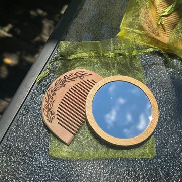 Wooden mirror and comb set engraved with floral design