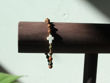 Cross bracelet with earth tone stone beads