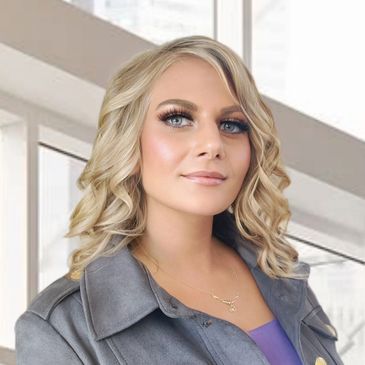 Blonde woman with curly hair and a confident smile.
