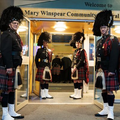 Four Drummers in full dress greeting guests at entrance doors to our annual Burns Dinner 