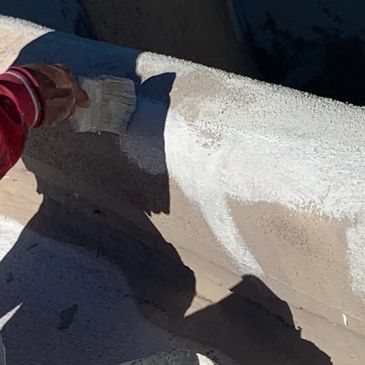 Stucco repair on all parapet walls 