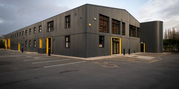 Modern industrial building with yellow accents.