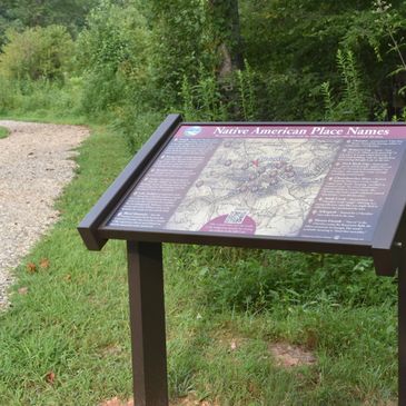 Informational sign about Native American place names in a natural park.