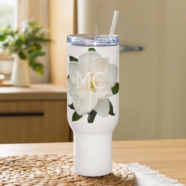 Magnolia Travel Mug on a Table charger