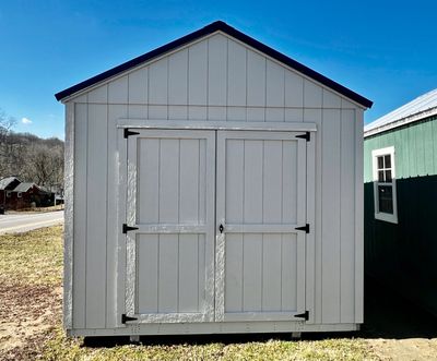 beige shed with double doors