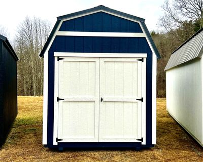 blue shed with white double doors
