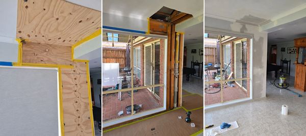 Home renovation showing wall repair and window installation.