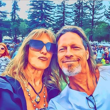 Stylized portrait of a joyful couple at an outdoor event.