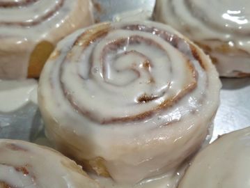 Close-up of a glazed cinnamon roll.