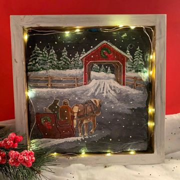 Lights up and comes in the wooden frame.