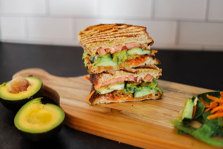Green God pressed sandwich with fresh vegetables
