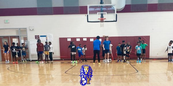 Dominion Youth Inc male and female basketball players learn skills on basketball court