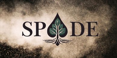 Spade Wellness Studio business logo with cloud of dust as the background