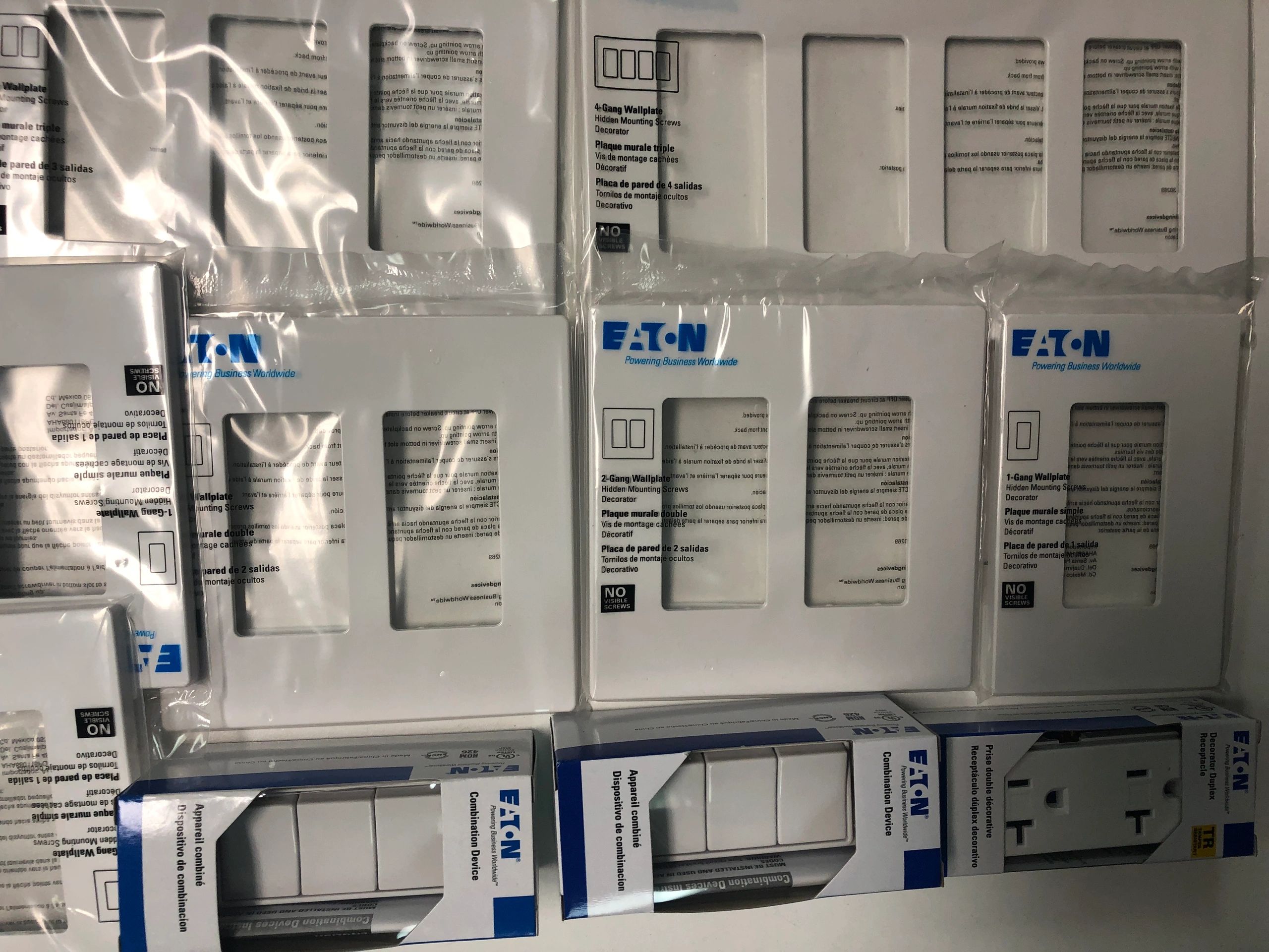 Eaton brand electrical wallplates and combination devices in packaging.