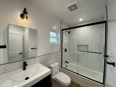 Small bathroom remodel los angeles, modern black fixtures, beautiful classic bathroom tile