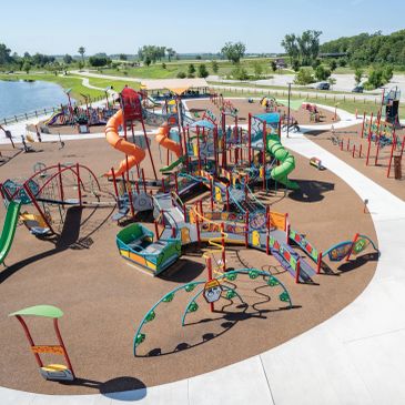 Colorful outdoor playground with slides and climbing structures.