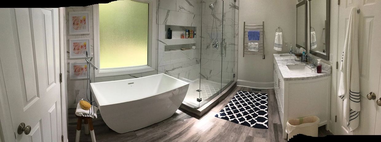 Modern bathroom with tub, shower and vanity