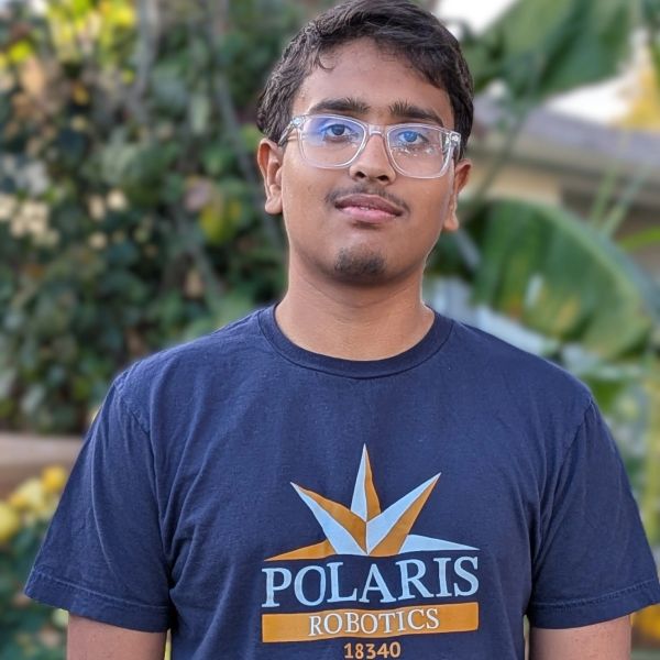 Young man wearing Polaris Robotics t-shirt and clear glasses.