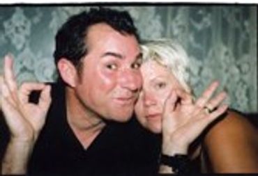 Man and woman posing closely for a photo