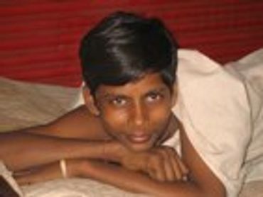Young boy with short hair looking at the camera